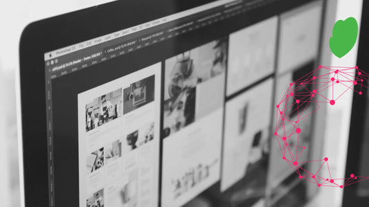 A web designer reviewing responsive website layouts and graphic mockups on a desktop monitor for an Ottawa small business website.